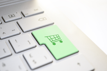 A computer enter key has been replaced with a shopping cart key — this image represents transitioning prospects from your blog posts to your sales pages